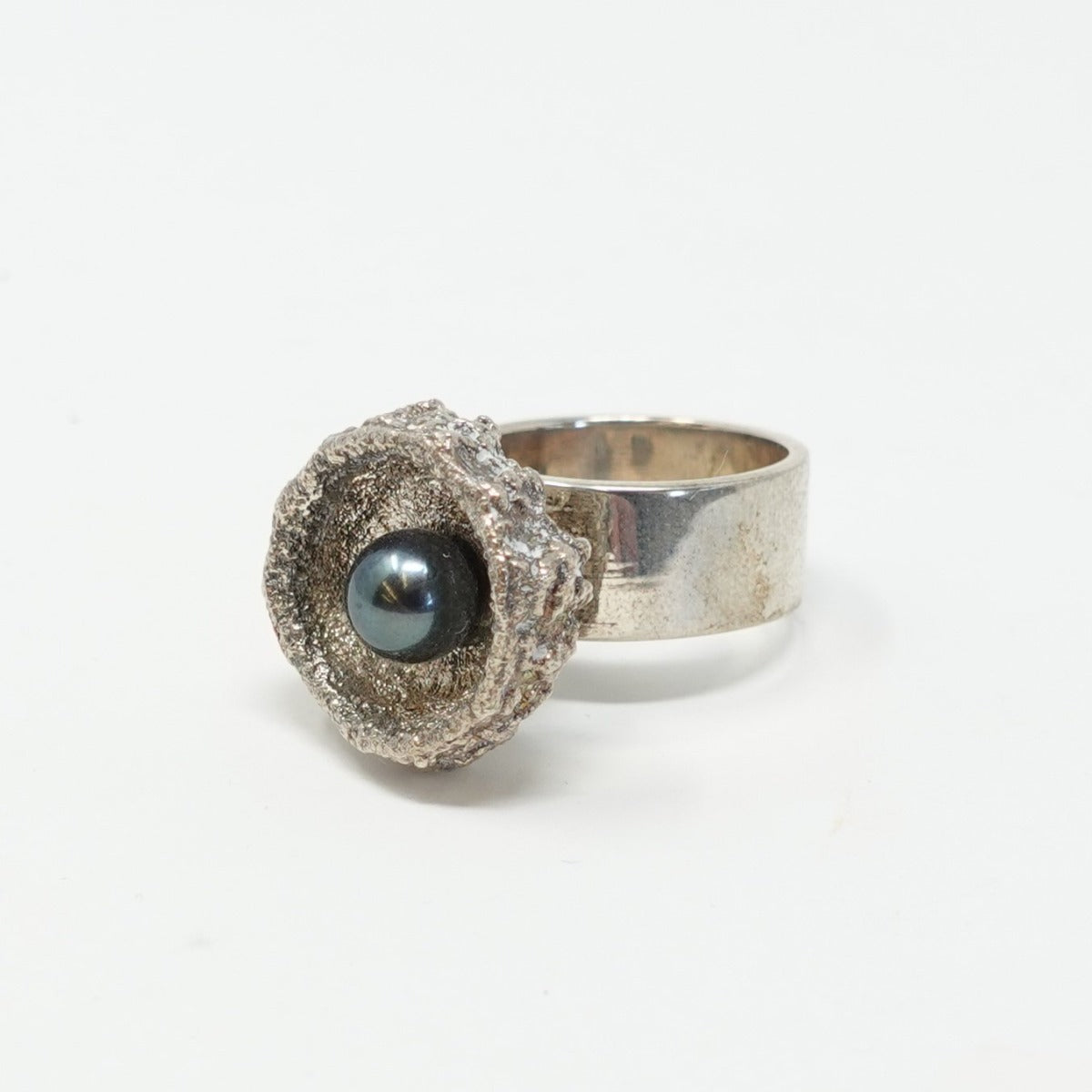 Jonathan Rout - Silver band ring - with silver basket holding iridescent orb